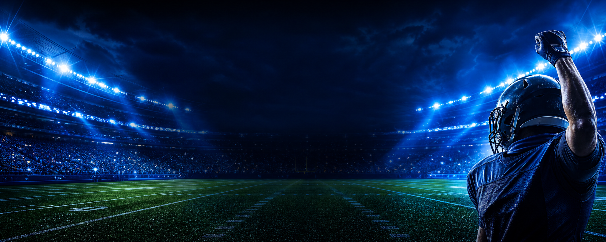 Electric blue football stadium at night